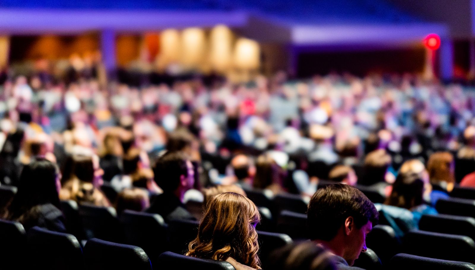 Audience seated in rows at an indoor conference
