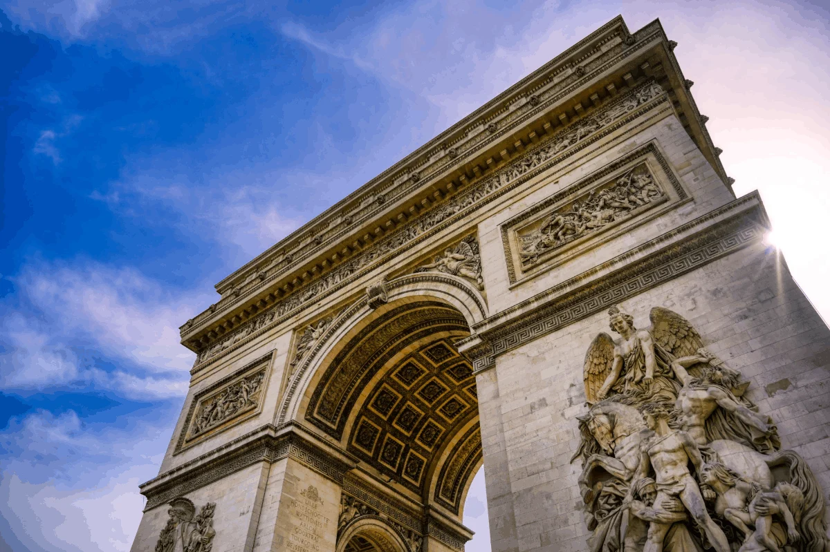 The Arc de Triomphe under a blue sky